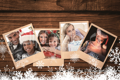 Composite image of portrait of an father and son holding a christmas gift