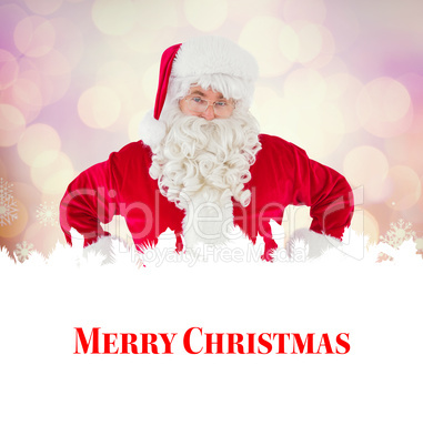 Composite image of cheerful santa claus with his hands on hips