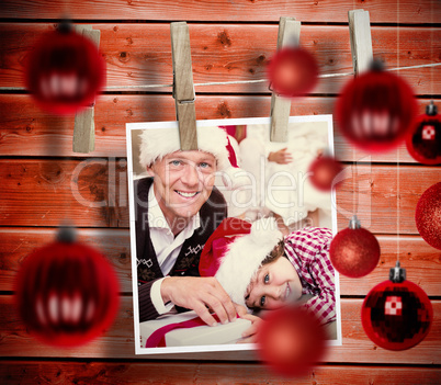 Composite image of christmas baubles