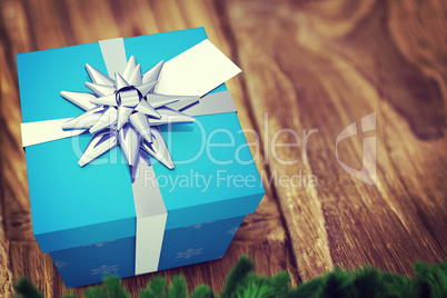 A blue Christmas gift with ribbon