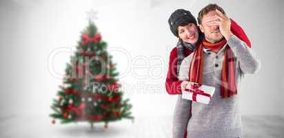 Composite image of woman giving man a present