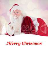 Composite image of santa asking for quiet with bag