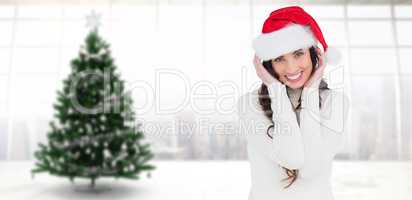 Composite image of festive brunette smiling at camera