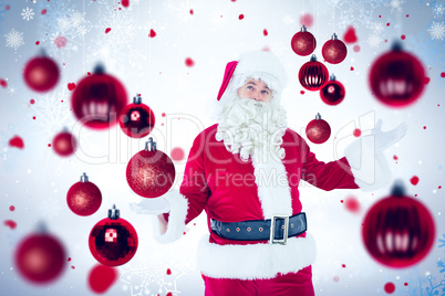 Composite image of father christmas with his hands out