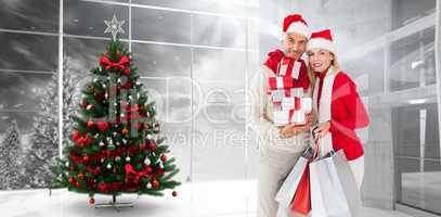 Composite image of happy festive couple with gifts and bags