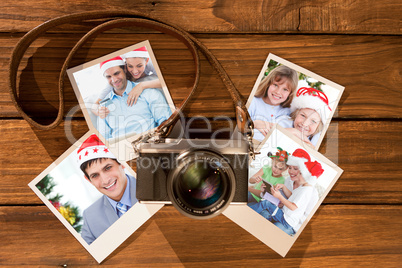 Composite image of cute couple in santa hats shopping online with laptop
