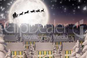 Composite image of silhouette of santa and reindeer