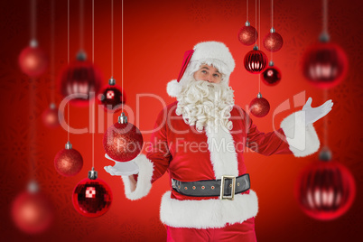 Composite image of father christmas with his hands out