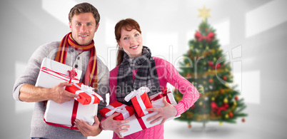 Composite image of couple holding lots of presents