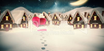 Composite image of rear view of santa holding a sack