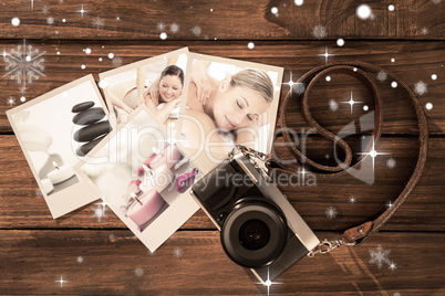 Composite image of positive young couple enjoying a back massage