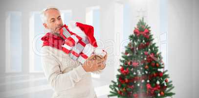 Composite image of happy festive man with gifts