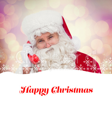 Composite image of santa claus on the phone