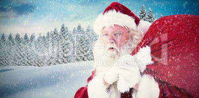 Composite image of santa takes care about his sack