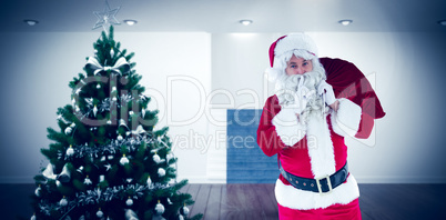Composite image of santa holding sack and keeping a secret Composite image of santa holding sack and keeping a secret