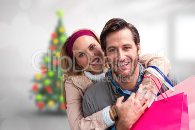 Composite image of smiling couple embracing