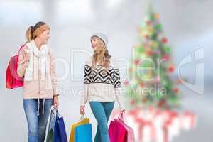 Composite image of beautiful women holding shopping bags looking