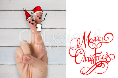 Composite image of christmas fingers