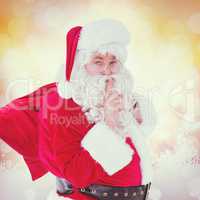 Composite image of santa keeping a secret and holding his sack