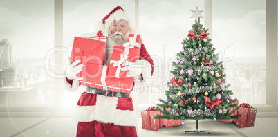 Composite image of santa carries a few presents