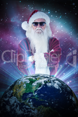 Composite image of santa claus wears black sunglasses