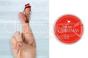 Composite image of christmas fingers