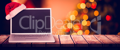 Composite image of christmas laptop