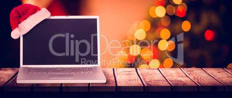Composite image of christmas laptop