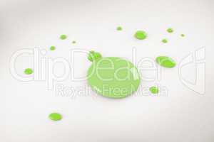 A green bauble paint splash
