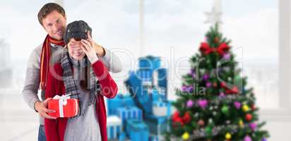 Composite image of man giving woman a present