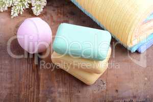 towels set, aroma therapy, soap and sea salt on wooden plate