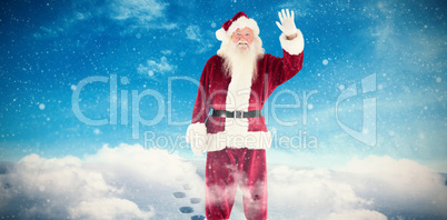 Composite image of jolly santa waving at camera