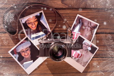 Composite image of pretty brunette in santa outfit opening gift