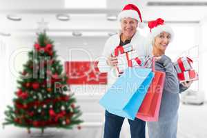 Composite image of couple with shopping bags and gifts