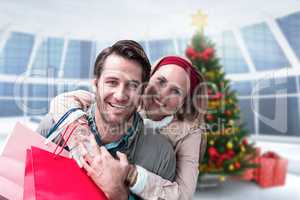 Composite image of smiling couple embracing