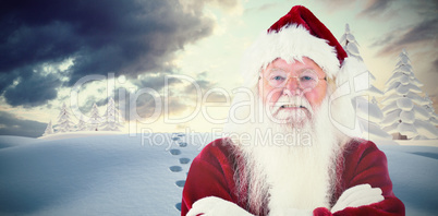 Composite image of santa smiles with folded arms