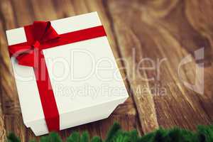 A white Christmas gift with ribbon
