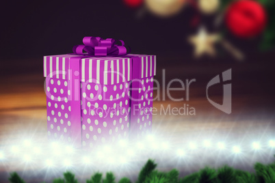 A purple Christmas gift with ribbon