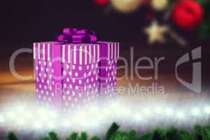A purple Christmas gift with ribbon