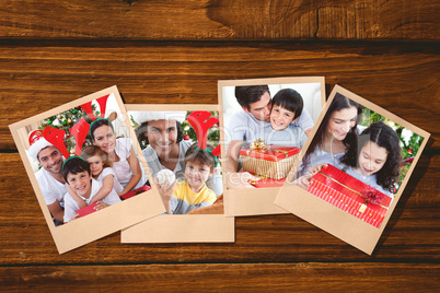 Composite image of lovely family giving presents for christmas