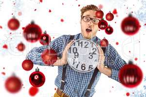 Composite image of geeky businessman holding a clock