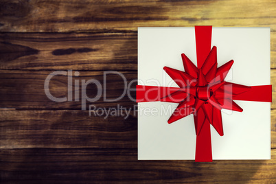 A white Christmas gift with ribbon