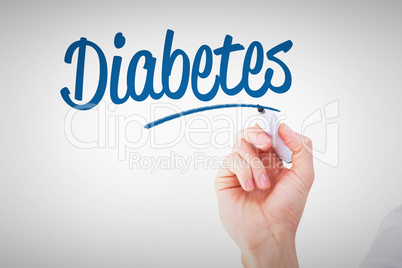 Diabetes against businessmans hand writing with marker