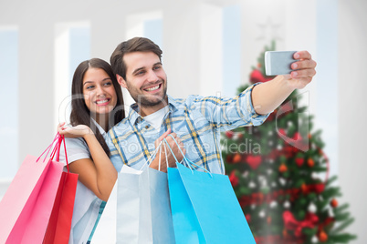 Composite image of happy couple taking a selfie