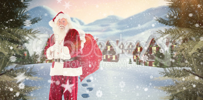 Composite image of santa smiling at camera