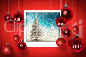 Composite image of christmas tree in snowy landscape
