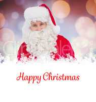 Composite image of happy santa holding paper and pen