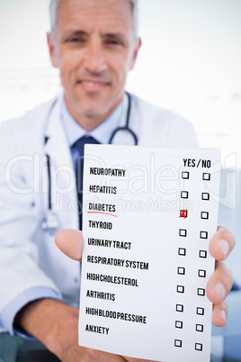 Composite image of portrait of a male doctor showing a blank pre