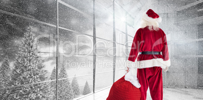 Composite image of santa carrying sack of gifts Composite image of santa carrying sack of gifts