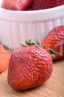 Strawberry set on wooden plate close up